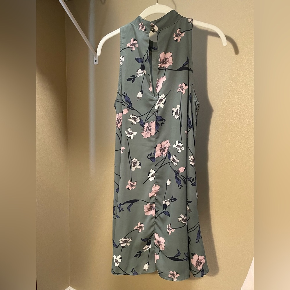 Small, swingy floral dress.